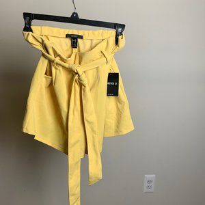 simple, yellow flared shorts